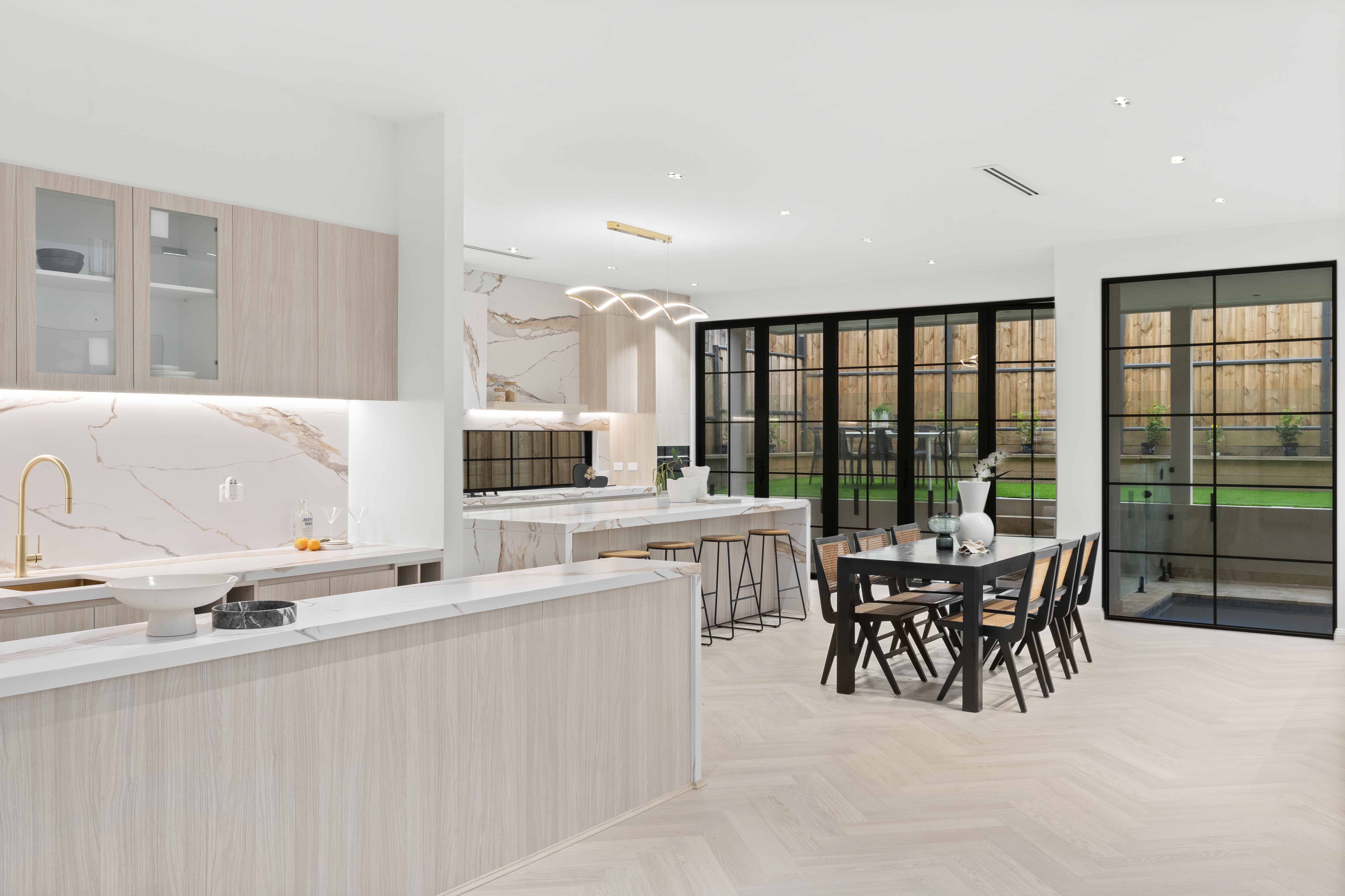 Open Plan Kitchen — Marble Benchtops & Dining